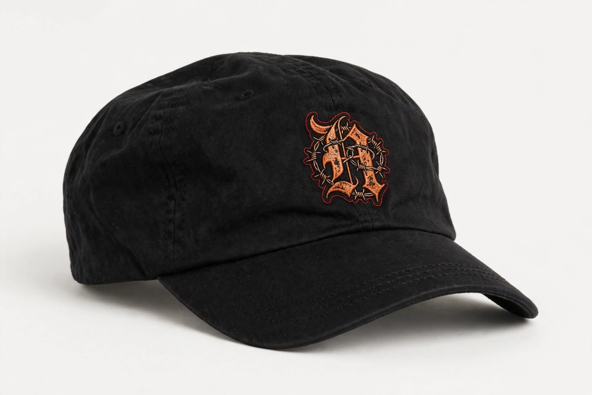 Black HEXSIN Flexfit dad hat, front view: the barbed-wire H emblem embroidered in rust and red on the front